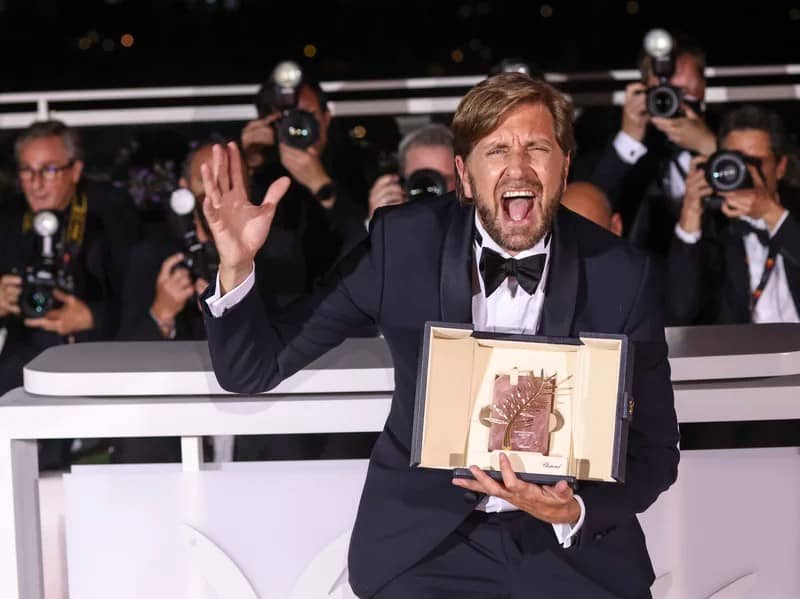 Writer/director Ruben Ostlund, winner of the Palme d'Or for 'Triangle of Sadness,' poses for photographers during the photo call following the awards ceremony at the 75th international film festival, Cannes, southern France, Saturday, May 28, 2022.